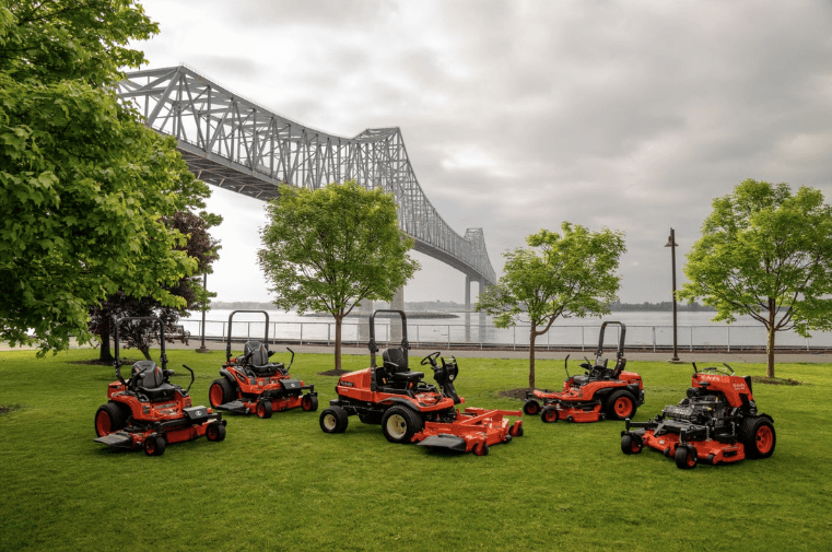 Lineup of mowers on a field 