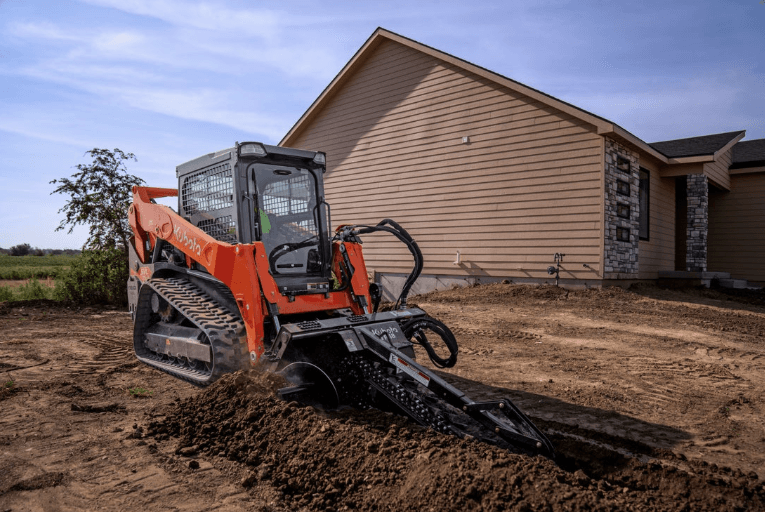 Track Loader using front attachment on work site