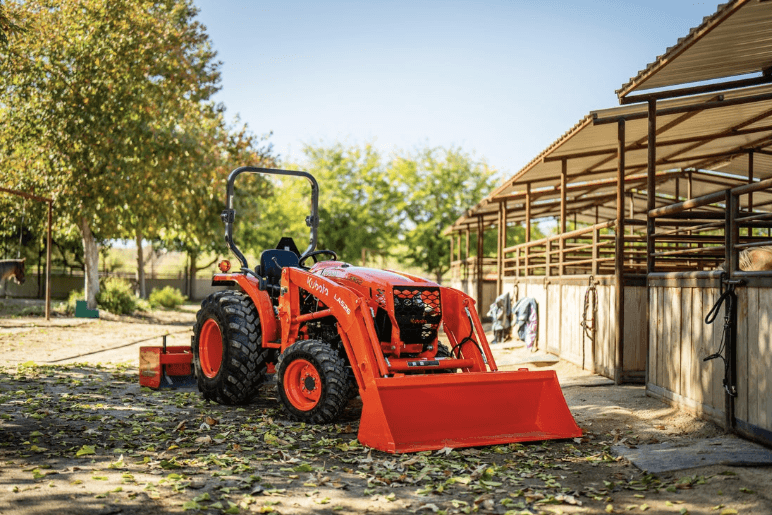 Tractor parked outside of stables