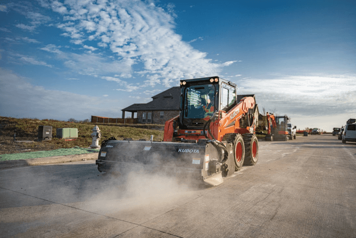 Kubota skid steer with sweeper attachment