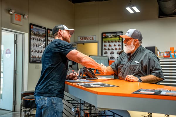salesman and renter shaking hands